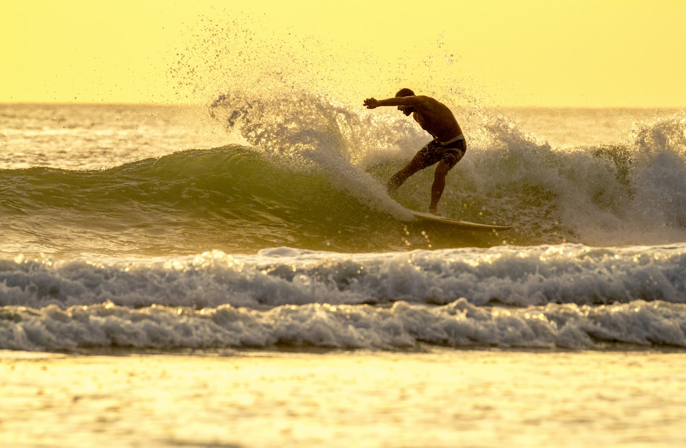 Surfing at Playa Amarilla, Nicaragua.