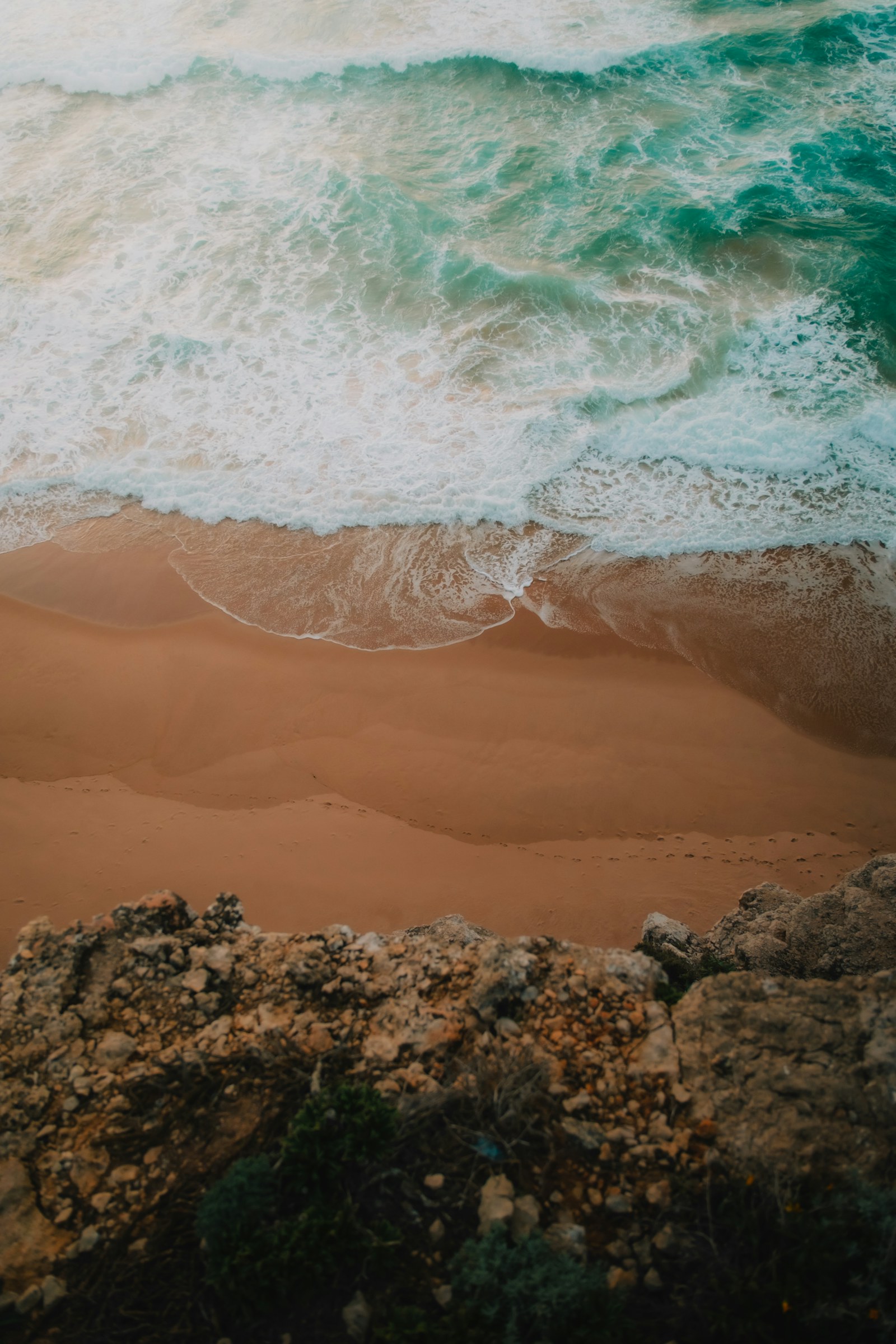 Clean Atlantic lines approaching a sandy Algarve beach