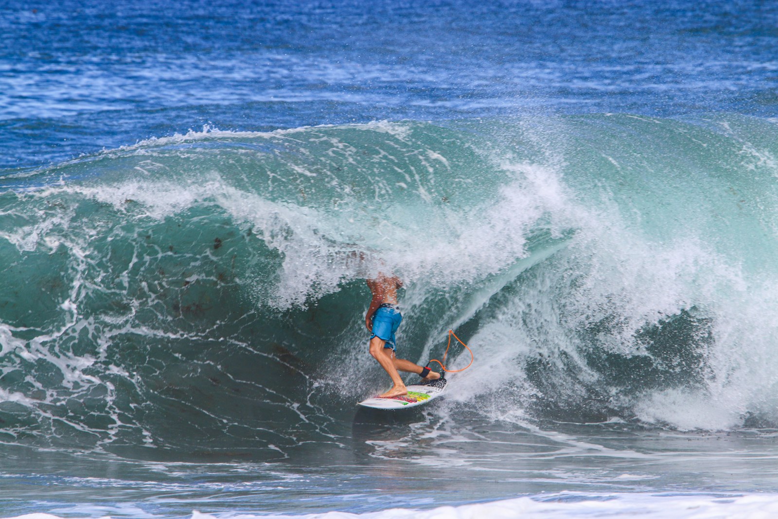 Surfer tucked into a clean wave in the Azores