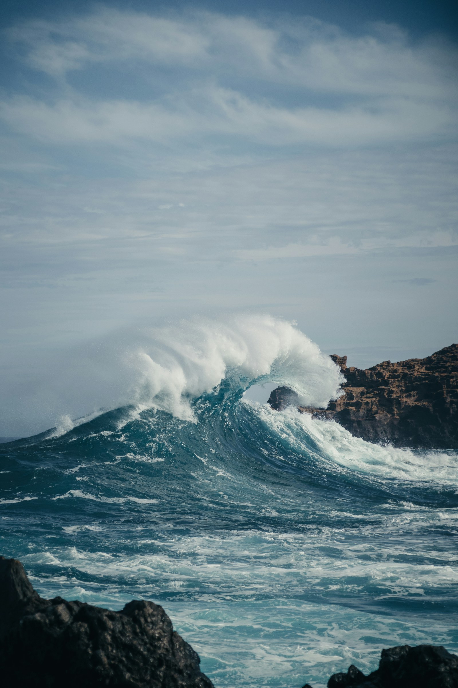 A powerful Atlantic wave breaking over the rocks in Madeira, Portugal