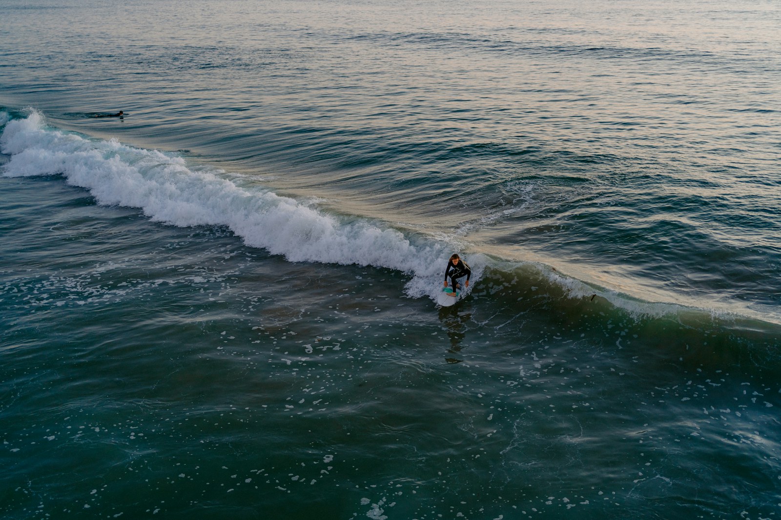 Surfer riding a wave in San Clemente, California