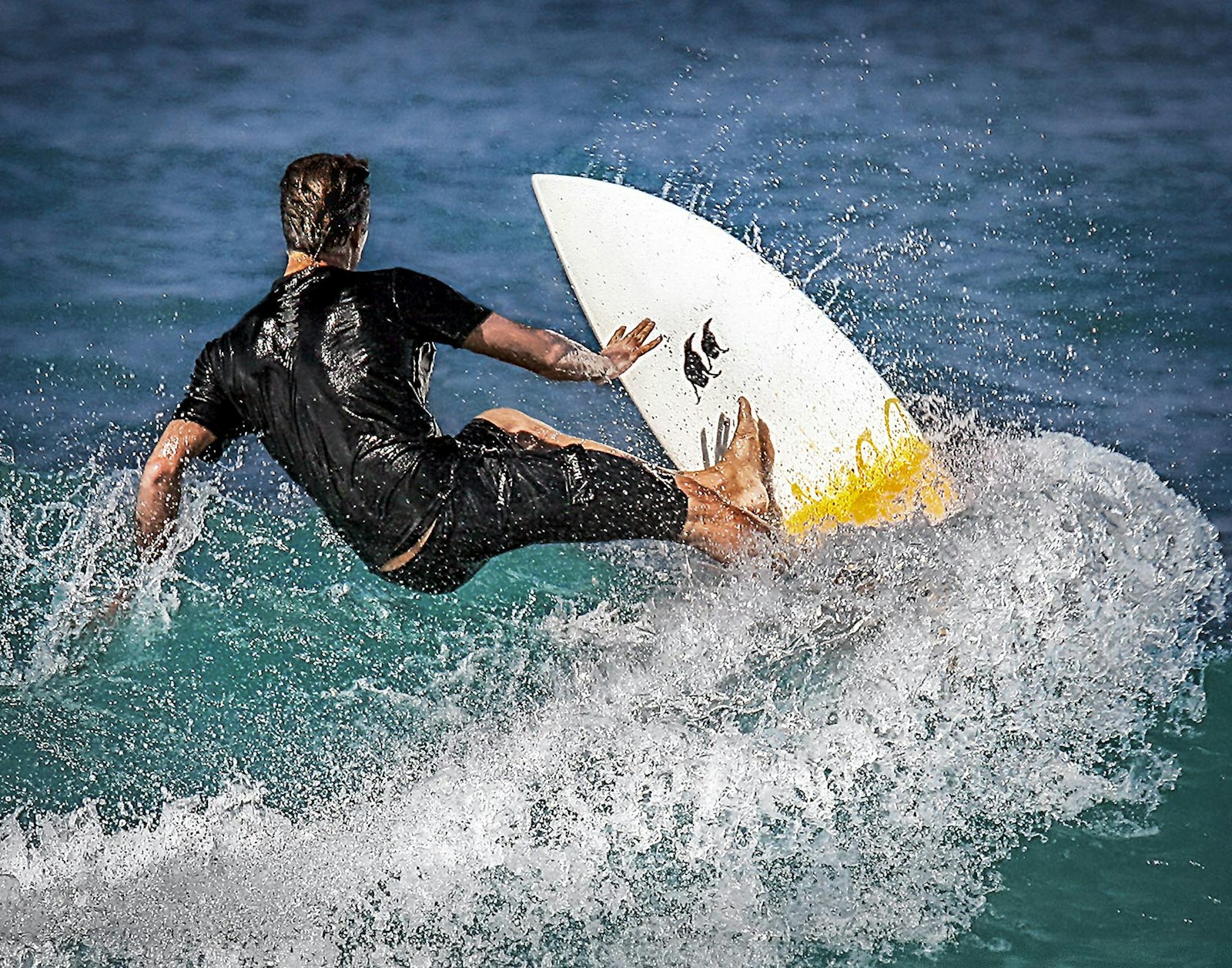 Surfer carving on the North Shore of Oahu