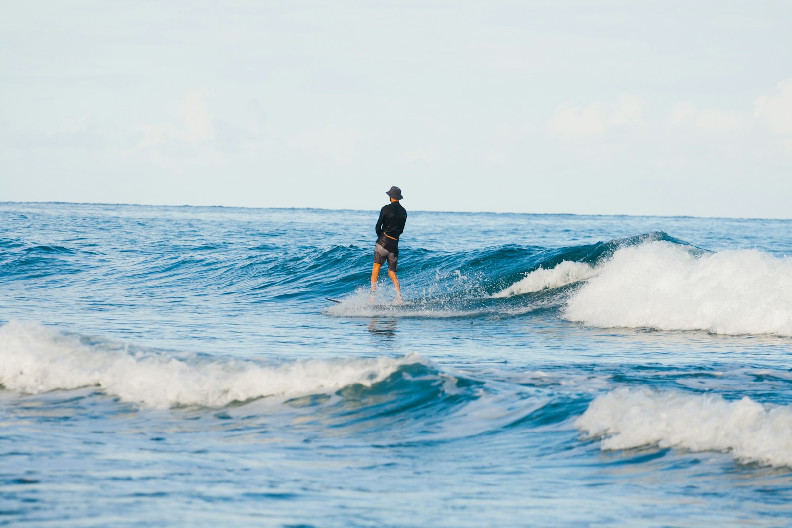 Surfer riding a wave in Rincón, Puerto Rico